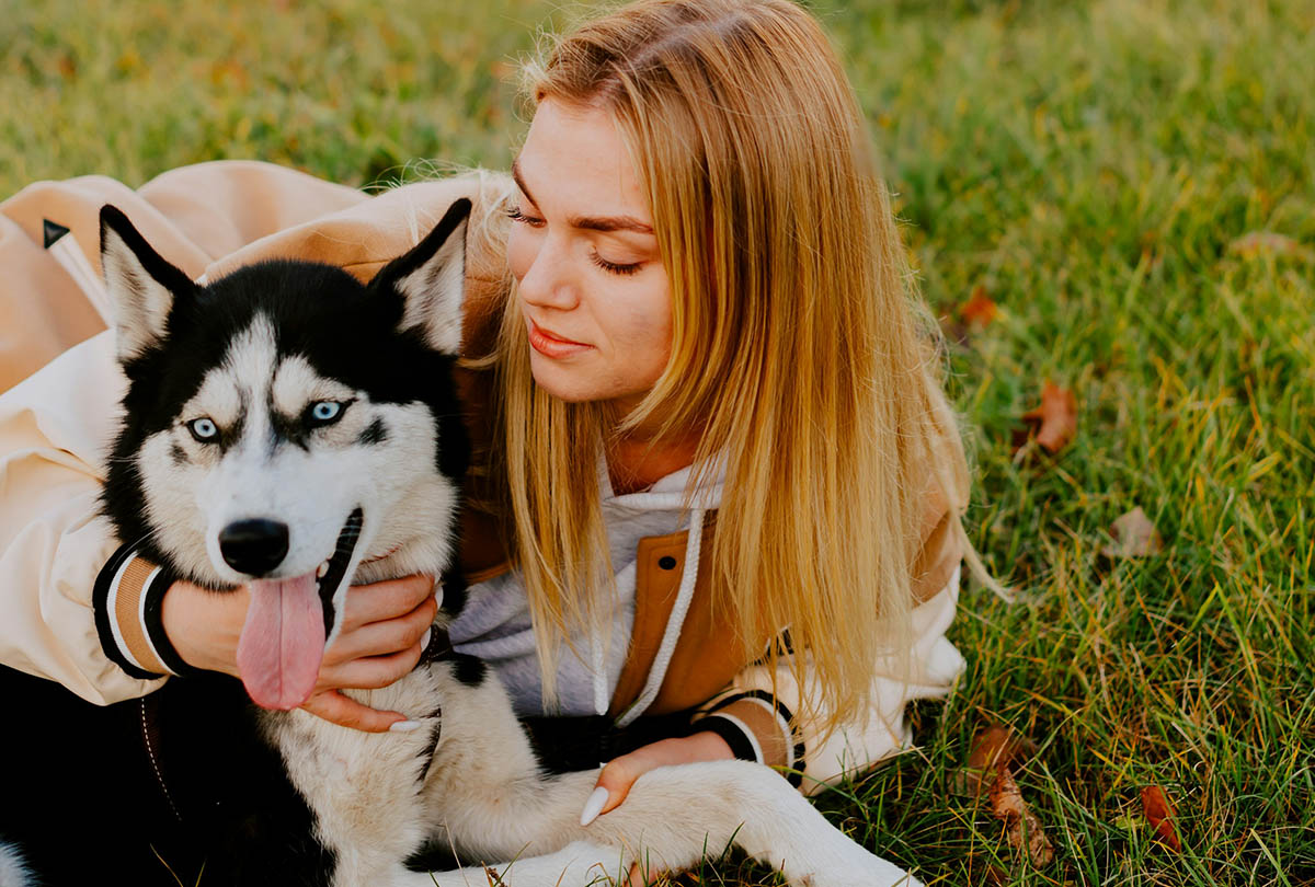 Dog smiles with owner.